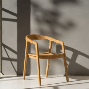 Nordic teak wood dining chair with curved backrest and minimalist design